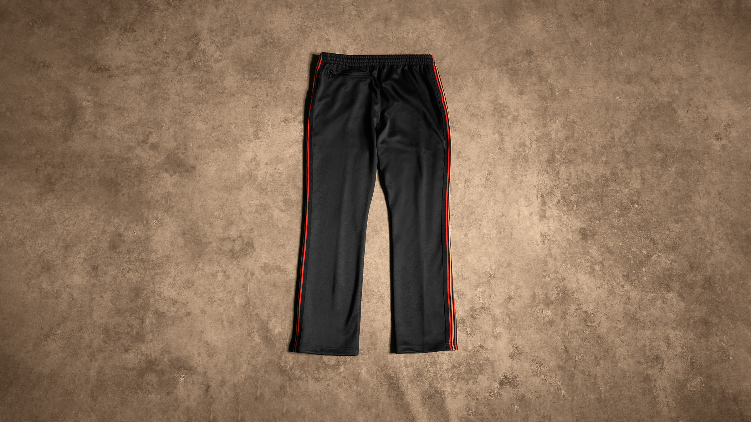 END. x Needles Narrow Track Pant (Black & Orange) | END. Launches