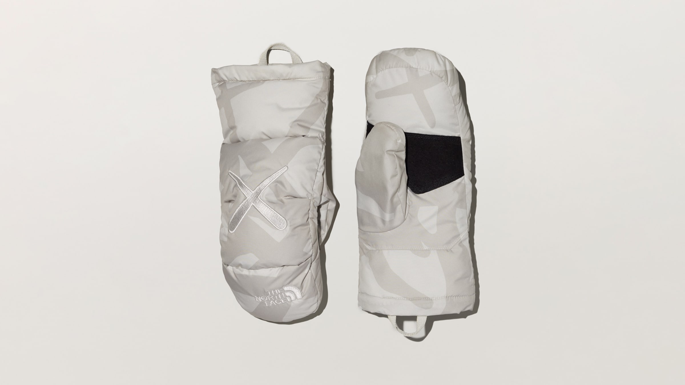 The North Face x KAWS Nuptse Mitt (Moonlight Ivory) | END. Launches